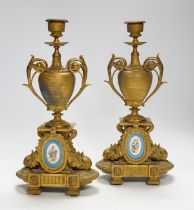 A pair of 19th century French ornamental gilt metal candlesticks, possibly clock garnitures, 32.