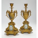 A pair of 19th century French ornamental gilt metal candlesticks, possibly clock garnitures, 32.