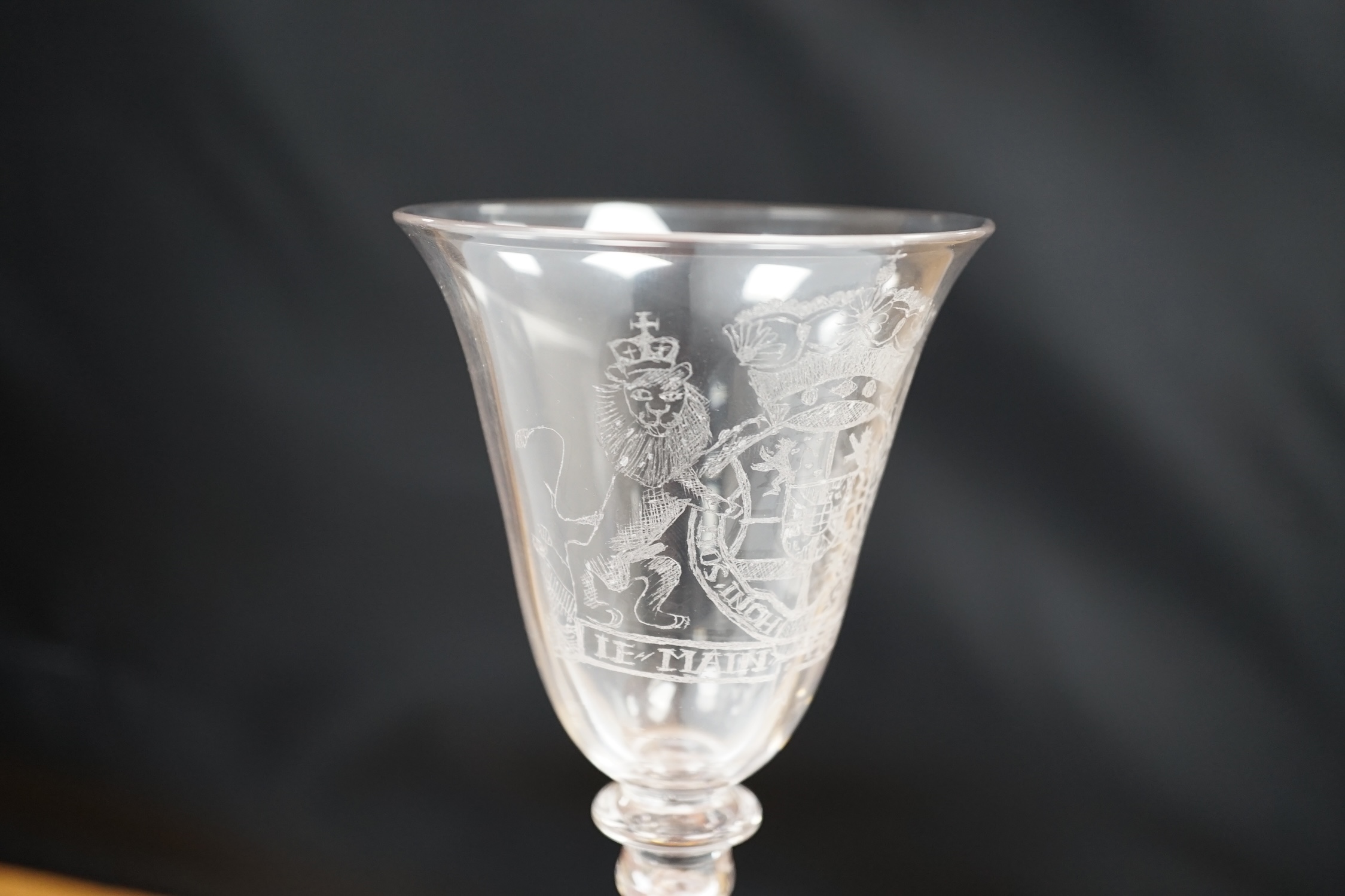 An 19th century diamond point engraved armorial glass, with knopped stem, air tears and rough - Image 3 of 5