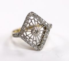 An 18ct, plat and diamond cluster set diamond ring, of diamond shape with pierced 'spider's web'