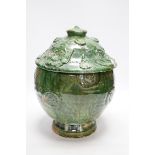 A Chinese Buddhist green glazed jar and cover, Song-Yuan dynasty, 33cm