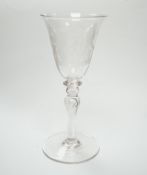 An 19th century diamond point engraved armorial glass, with knopped stem, air tears and rough