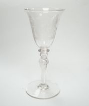 An 19th century diamond point engraved armorial glass, with knopped stem, air tears and rough