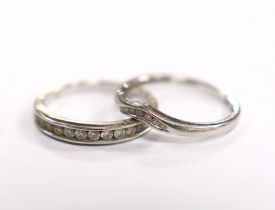 A modern 9ct white gold and diamond chip set half eternity ring, size M and a similar 9ct gold