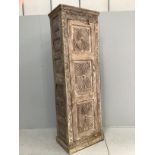 An Indian carved hardwood tall side cabinet, width 72cm, depth 48cm, height 218cm