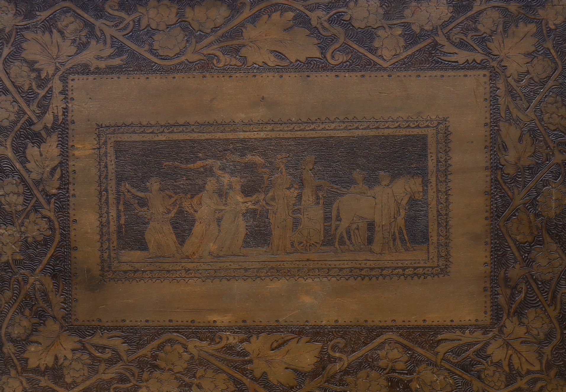 A 19th century Pyrography panel, depicting a classical procession of figures and floral border, 34 x