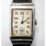 A gentleman's mid 20th century steel 'reverso' manual wind rectangular dial wrist watch, with Arabic