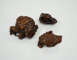 Three Japanese hardwood netsukes in the form of frogs and a swan, largest 5.5cm in length