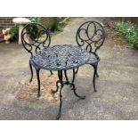 A circular painted aluminium garden table, diameter 60cm, height 70cm and two chairs