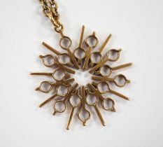 A yellow metal pendant, 37mm, on a 375 chain, 52cm, gross weight 17.8 grams.