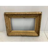 A Victorian rectangular giltwood and composition picture frame, width 73cm, height 105cm