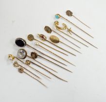 Fifteen assorted mainly early 20th century yellow metal and gem set stick pins, including diamond,