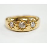 A George V 18ct gold and gypsy set three stone diamond ring, hallmarked for London, 1910, size S,