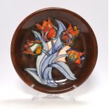 A Moorcroft 'Red Tulip' dish designed by Sally Tuffin, 26cm in diameter