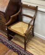 A pair of late Victorian Arts & Crafts mahogany rush seat elbow chairs, width 53cm, depth 49cm,