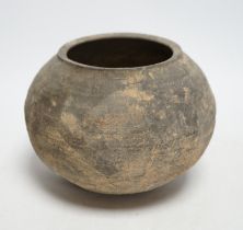 A Chinese black pottery jar, Han dynasty, 15cm tall