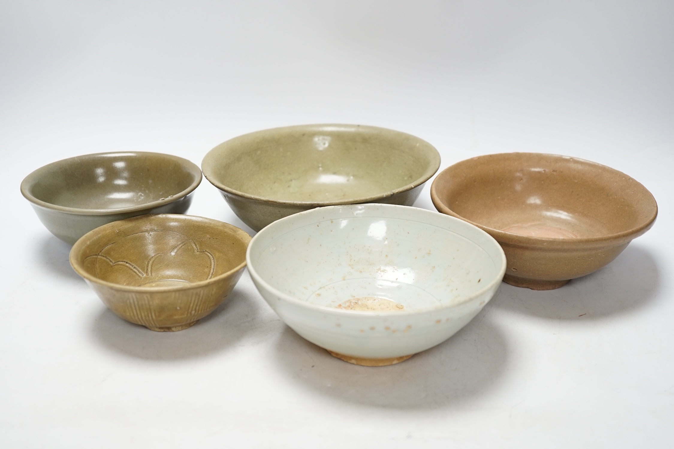 A group of four Chinese Longquan or Yue ware celadon bowls and a Qingbai bowl, Song-Yuan dynasty, - Image 2 of 10