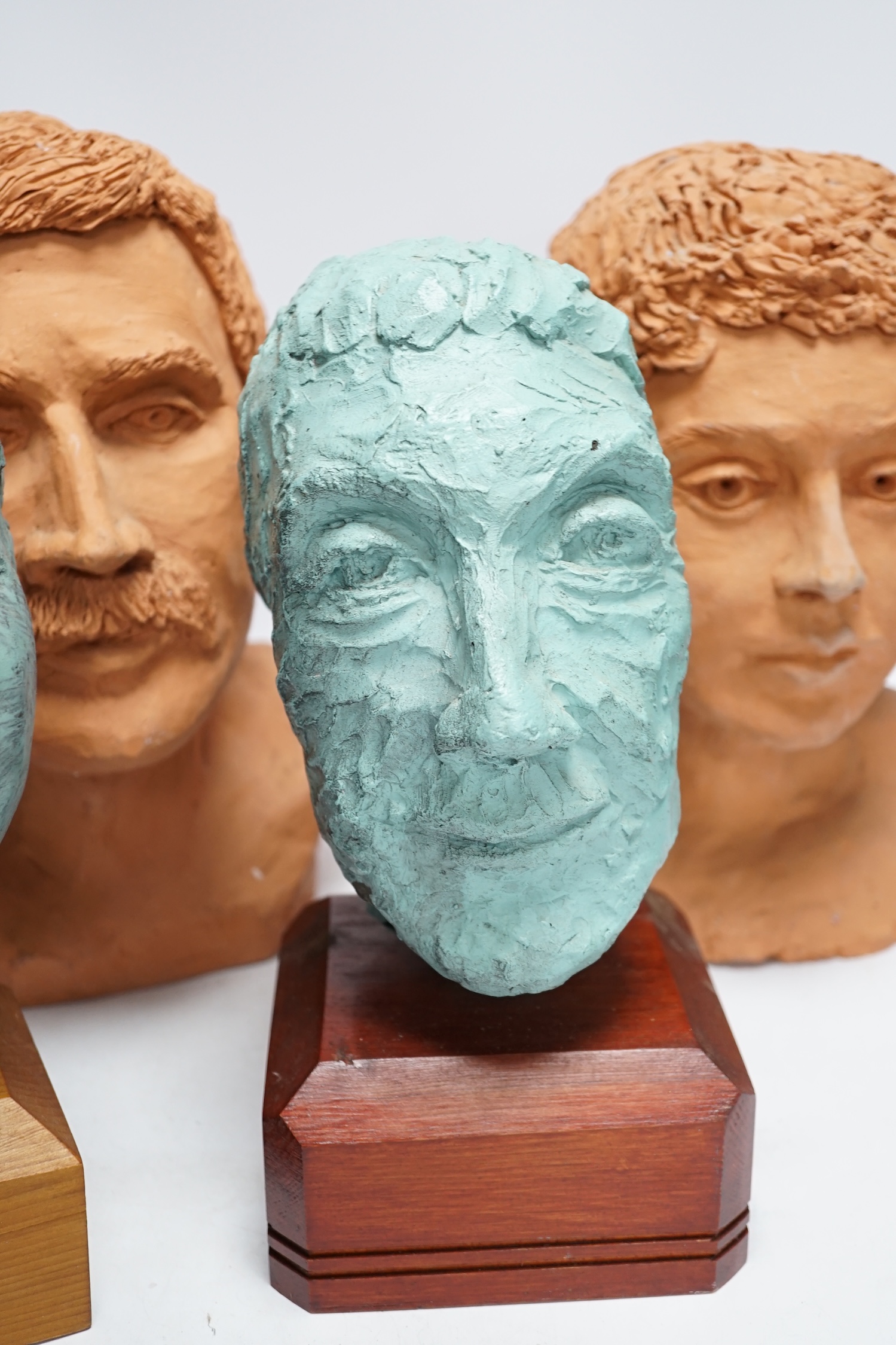 Four art pottery sculpted heads on stands, two terracotta and two painted verdigris green, largest - Image 5 of 5