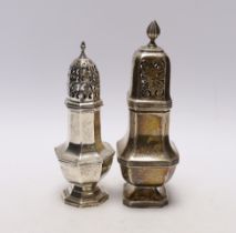 Two George V silver sugar casters, largest 18.4cm, 8.2oz.
