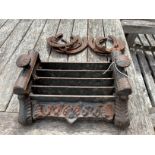 A Victorian style cast iron boot scraper, width 28cm together with six horseshoes