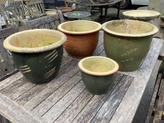 Four circular glazed earthenware garden planters, largest diameter 38cm, height 31cm