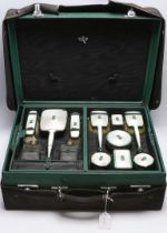 A George V silver, enamel and Chinese jadeite mounted twelve piece dressing table set,
