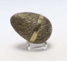 An Elizabeth II silver gilt surprise egg, by Stuart Devlin, London, 1974, numbered 76, opening to