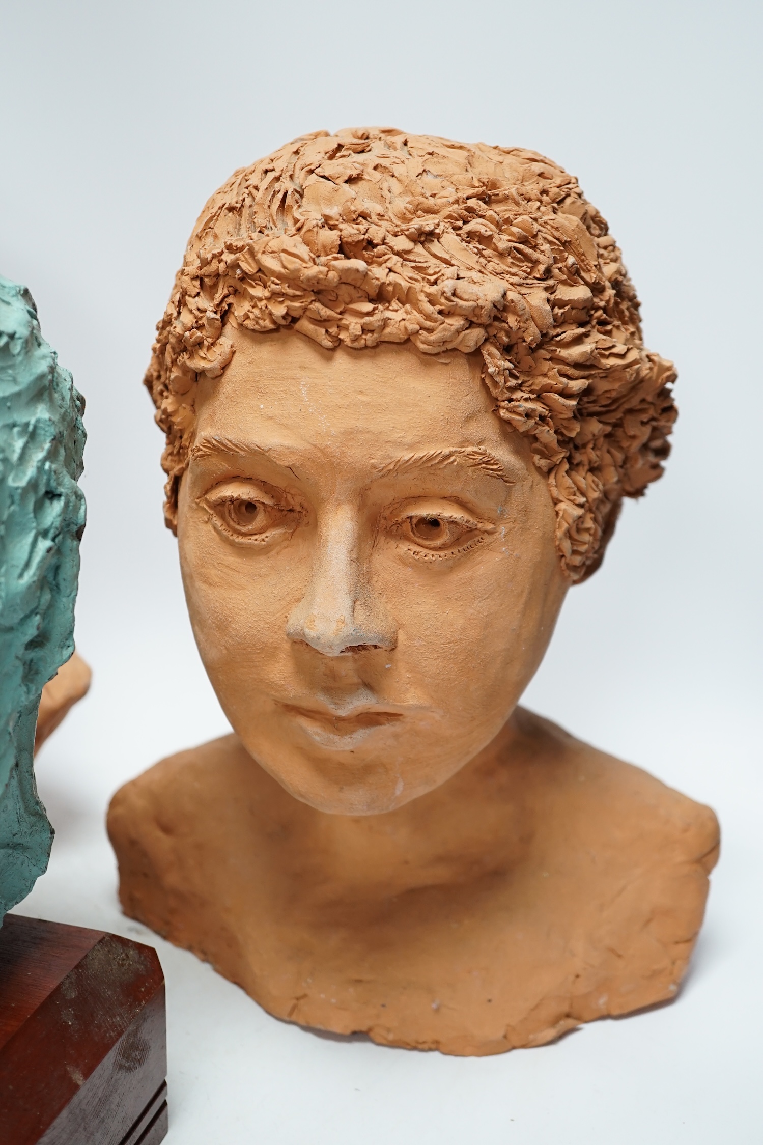 Four art pottery sculpted heads on stands, two terracotta and two painted verdigris green, largest - Image 3 of 5