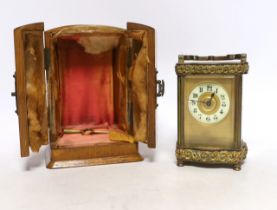 An early 20th century oak cased carriage timepiece, timepiece 12cm high