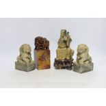 Two Chinese soapstone figures and a pair of Buddhist lion seals, tallest 19.5cm