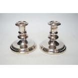 A pair of French Christofle silver plated dwarf candlesticks, 14cm