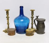A pair of 18th century brass candlesticks, a blue glass flagon, a horn snuff box, etc. candle sticks