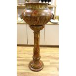 A large faux marble pottery jardiniere on stand, 126cm total height