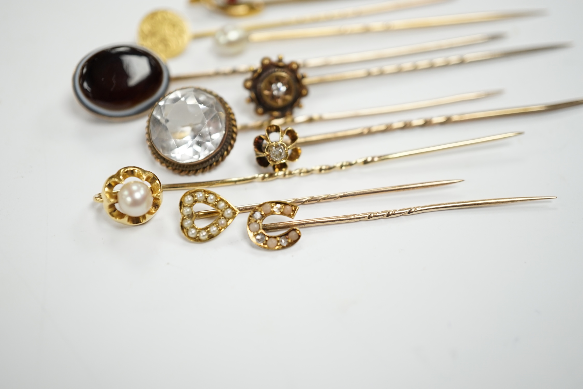 Fifteen assorted mainly early 20th century yellow metal and gem set stick pins, including diamond, - Image 6 of 11
