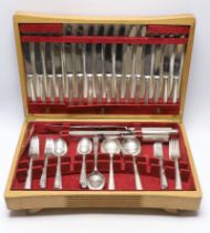 An Elizabeth II almost complete silver canteen of cutlery for eight by Cooper Brothers & Sons,