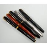 A Parker white metal fountain pen and four other Parker fountain pens, the vendor being an ex-Parker