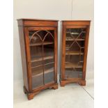 Two reproduction George III style mahogany narrow bookcases, width 50cm, depth 27cm, height 126cm