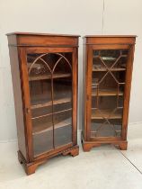 Two reproduction George III style mahogany narrow bookcases, width 50cm, depth 27cm, height 126cm