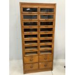 A mid century oak twenty drawer haberdashery cabinet, width 92cm, depth 51cm, height 197cm