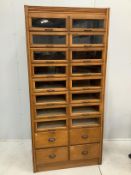 A mid century oak twenty drawer haberdashery cabinet, width 92cm, depth 51cm, height 197cm