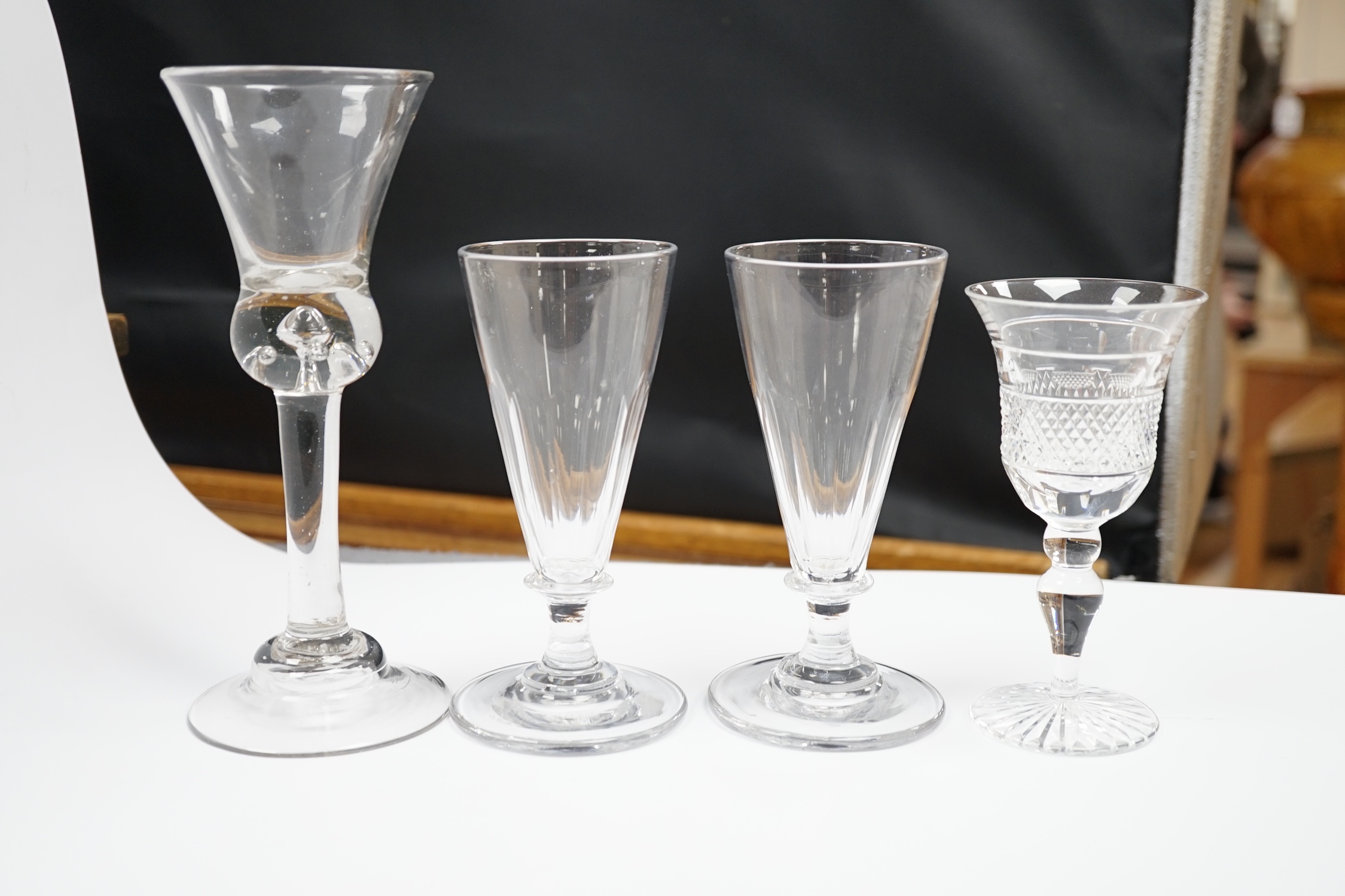 A pair of early 19th century dwarf ale glasses with fluted conical bowls, bladed knop stems and - Image 4 of 4