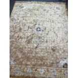 A Chinese gold ground carpet, 370 x 280cm