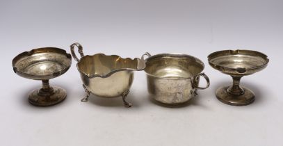 An Elizabeth II silver sauceboat, by Harrods Ltd, a silver two handled bowl and a pair of silver