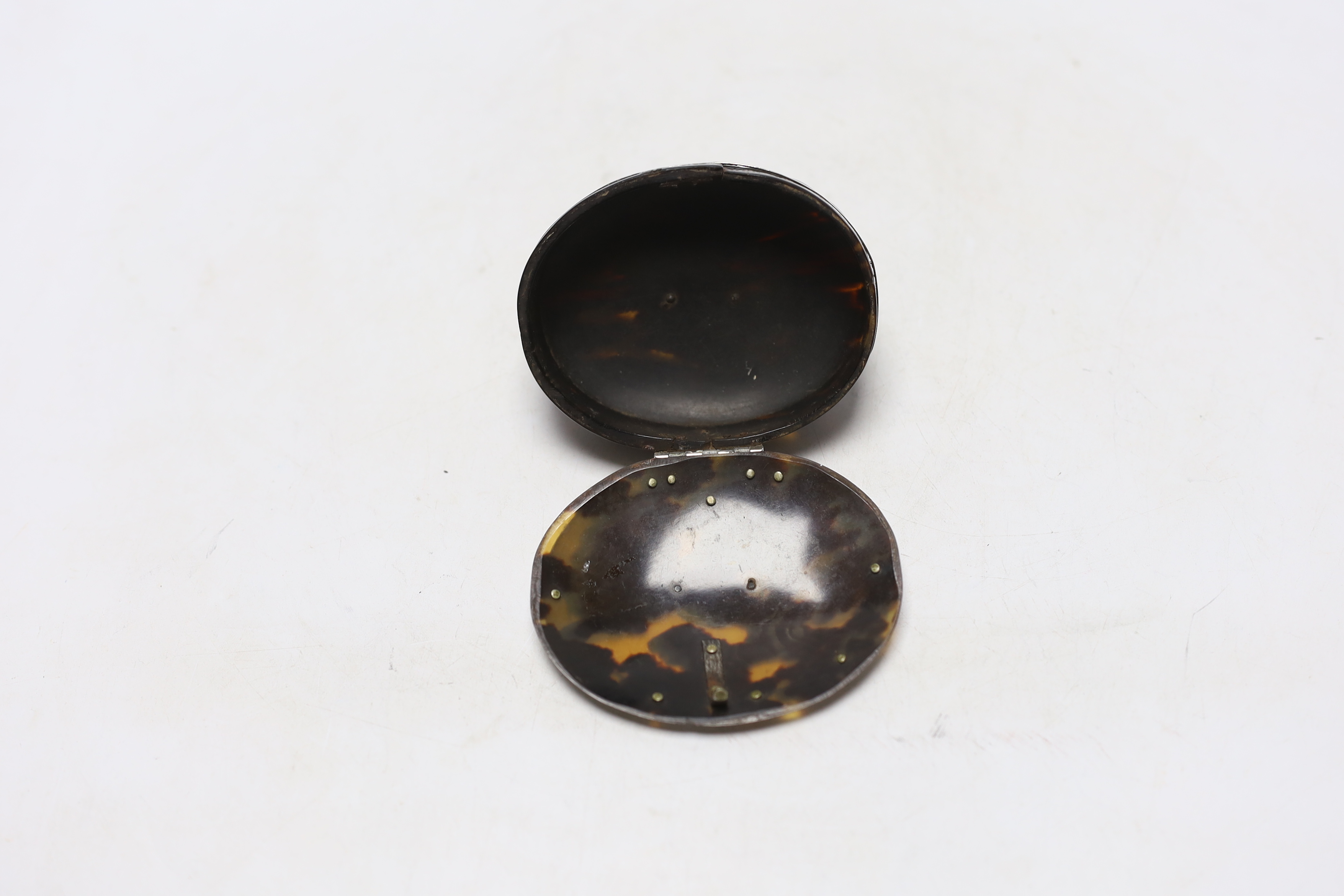 An early 19th century unmarked white metal mounted oval tortoiseshell snuff box, with fluted base, - Image 3 of 3