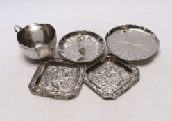 Chinese white metal items including two shaped dishes, a tea cup and two dragon dishes, largest 10.
