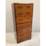 A reproduction 'Starbay' eight drawer narrow secretaire chest, width 55cm, depth 40cm, height 126cm