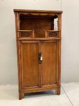 A Chinese carved elm cabinet, width 82cm, depth 55cm, height 182cm