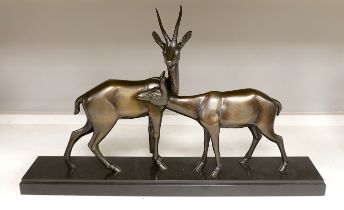 An Art Deco bronzed spelter ‘gazelle’ figure group, 70cm