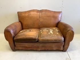 A French leather moustache back sofa, width 148cm, depth 80cm, height 80cm