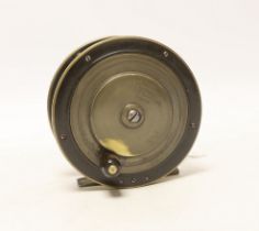 A large Bernard & Sons leather cased fishing reel